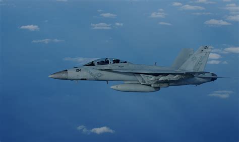 U.S. Navy F/A-18s conducting joint operations in the South China Sea