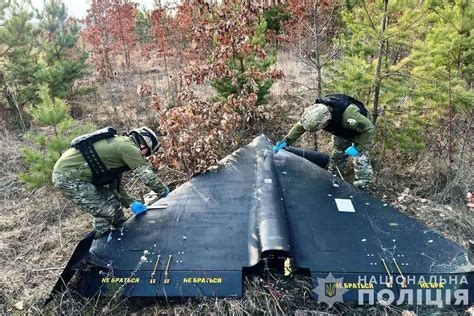 Ukrainian rescue personnel responding to a building hit by Shahed 136 drone strike in Kharkiv