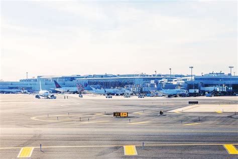 United Airlines aircraft parked at Newark Liberty International Airport with crew bus in foreground