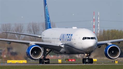 united airlines aircraft taxiing under bright sky, symbolizing bullish outlook on airline sector