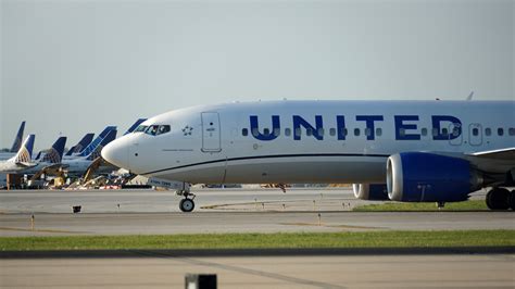 United Airlines Boeing 737 MAX 8 taxiing at international airport runway