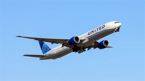 United Airlines Boeing 777 long-haul boarding at an international airport gate