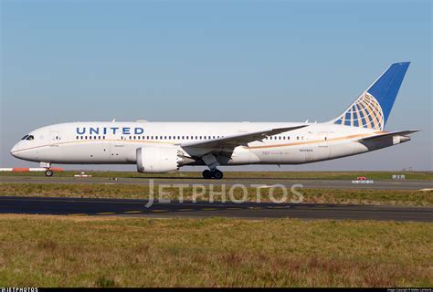 united airlines boeing 787-8 parked at christchurch airport under cloudy sky