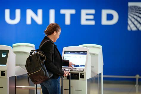 United Airlines Check-In at Newark Terminal C with Passengers Boarding European Flights