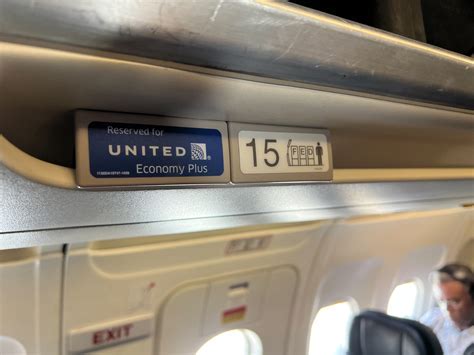 United Airlines economy passengers boarding 777 with cramped cabin space