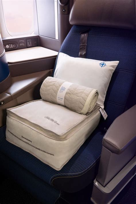 United Airlines Polaris business class turndown service with Saks Fifth Avenue bedding