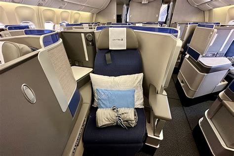 United Airlines Polaris cabin crew preparing premium business class meal service