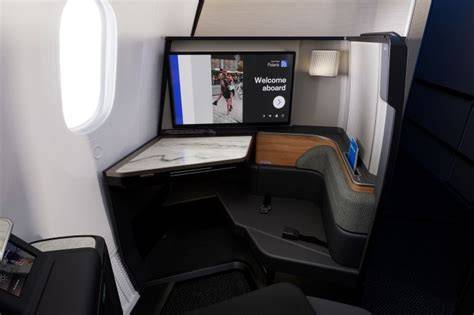 United Airlines Polaris Studio 27 inch OLED screen business class suite