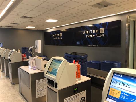United Airlines Premier 1K check-in counter signage at airport terminal