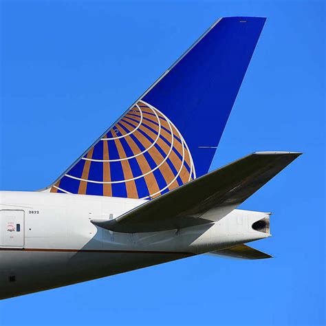 united airlines tail at sunset with havana skyline in distance