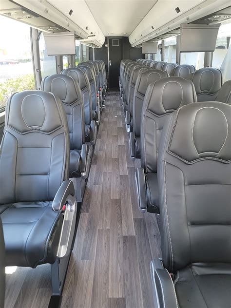 united landline bus interior with leather seating and passengers using wifi