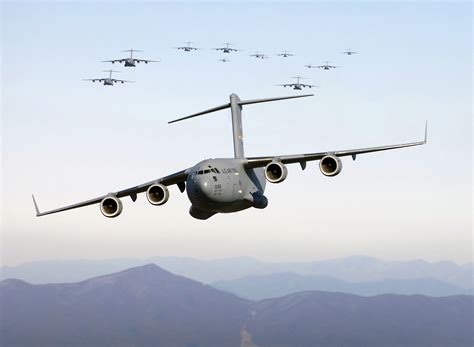 United States Air Force C-17 tactical combat descent over mountainous terrain