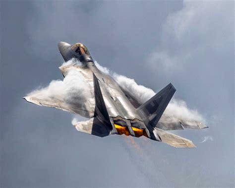 upgraded f-22 super raptor flying above desert training range
