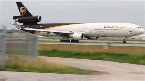 UPS Airlines Boeing 747-8F freighter departing Louisville cargo hub at sunrise