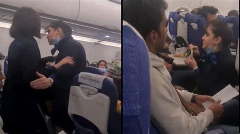 upset passengers airplane cabin conflict argument flight attendant intervening