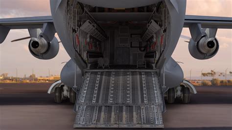 US Air Force C-17 Globemaster III cargo aircraft undergoing maintenance on flight line