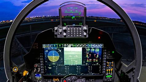 us air force pilot inside f-15ex eagle ii cockpit with touchscreen interface