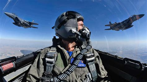 US Air Force pilot training jet formation flight blue sky