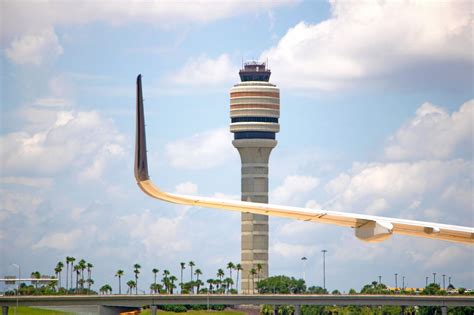 US air traffic control tower overseeing busy airport runways