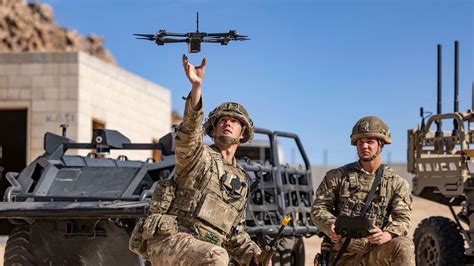 US Army soldiers deploying UAV drones from portable case during field mission