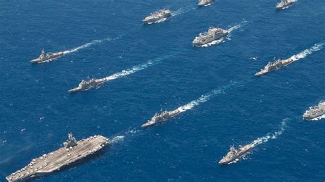 US Navy aircraft carrier strike group formation open ocean