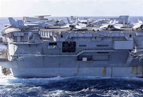 us navy carrier truman evading missile threat in red sea waters