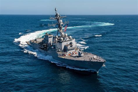 US Navy destroyer crew standing on deck during deployment Pacific Ocean