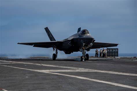 US Navy F-35C squadron commander aboard aircraft carrier flight deck