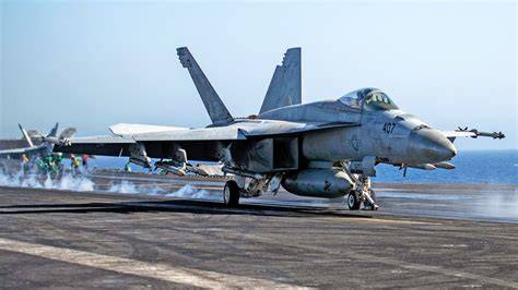 US Navy F/A-18E Super Hornet pilot preparing for carrier operations