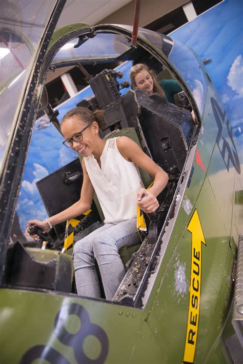 US Navy flight students in simulation training center using VR-based cockpit trainers