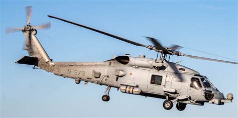 US Navy MH-60R Seahawk helicopter pilot during carrier flight operations