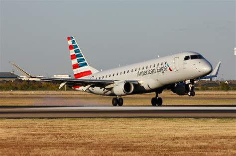 US regional aviation aircraft Embraer E175 regional jet fleet at airport terminal