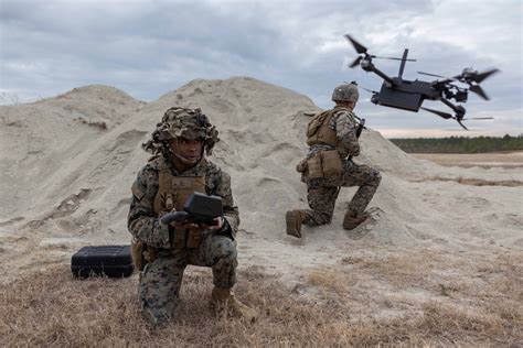 US special tactics team deploying small drones in contested urban environment night operation