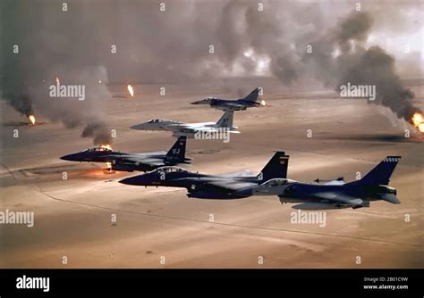 USAF F-15E in Gulf War desert camouflage flying low over Kuwaiti desert