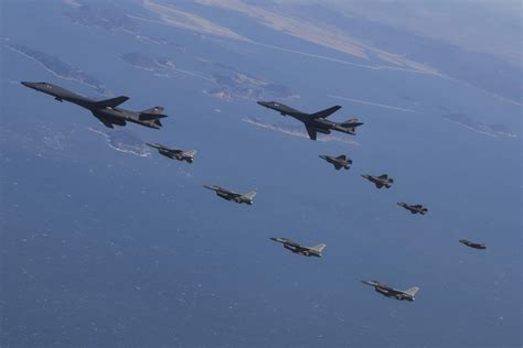 USAF F-16s in tight formation over the Korean Peninsula during joint drills