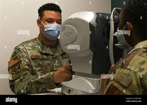 USAF optometry technician preparing cadet for FCI vision exam