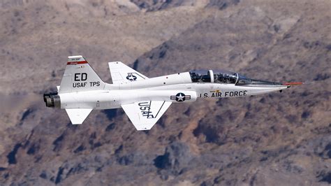 USAF Test Pilot School T‑38C alongside chase F‑16 during flutter expansion