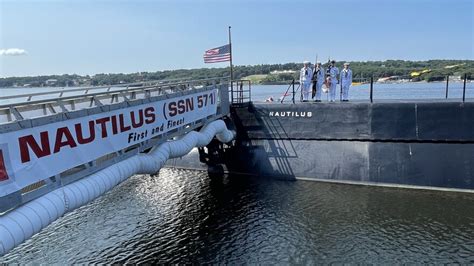 USS Nautilus nuclear submarine departing from naval base