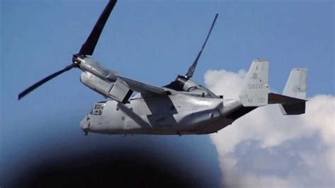 V-22 Osprey transitioning from vertical to forward flight above Pacific waters