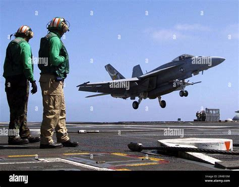 VFA-137 pilots receiving the Battle Efficiency “E” Award on deck