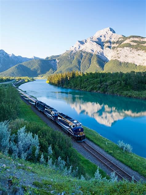 via rail train traveling through rockies with canada strong pass discount passengers onboard