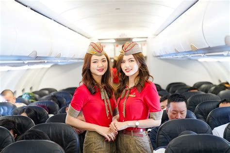 VietJet Air cabin crew boarding passengers at Tan Son Nhat Airport