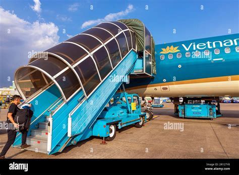 Vietnam Airlines aircraft fleet parked at Tan Son Nhat International Airport during sunset