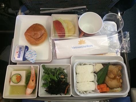 Vietnam Airlines in-flight meal with traditional Vietnamese fish and rice served with tropical fruit