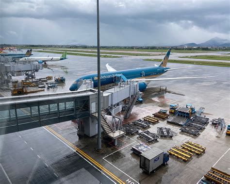 Vietnamese aviation officials examining safety procedures at Noi Bai Airport taxiway
