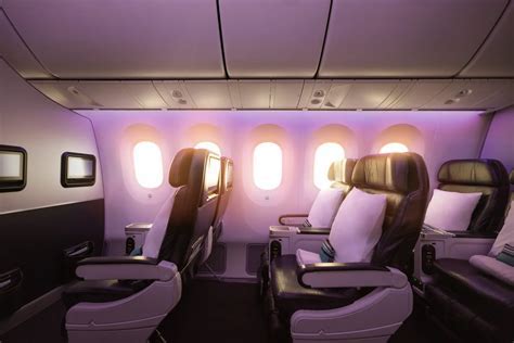 view from an Air New Zealand premium economy seat flying over Bali coast at sunrise