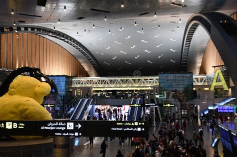 view of Hamad International Airport terminal at night with Qatar aircraft