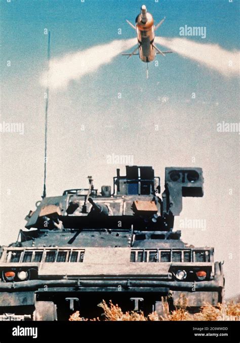 vintage TOW missile system on tracked vehicle with cables visible