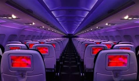Virgin America aircraft with signature mood-lit interior in-flight cabin view