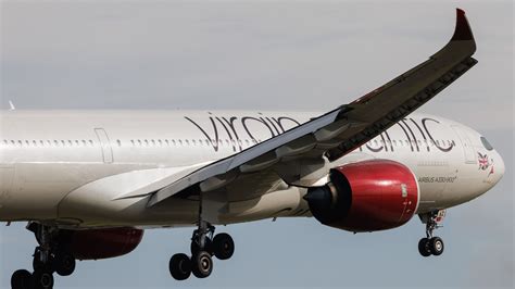 virgin atlantic airbus a330-900neo flying over clouds upper class focus